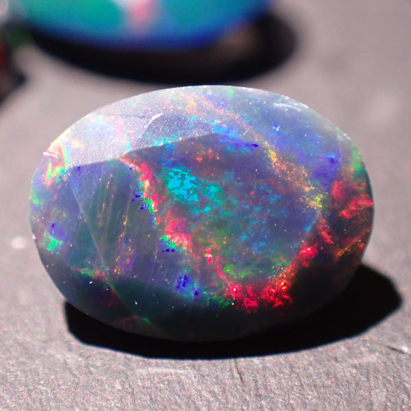 Black Opal 8.2x6.1mm Faceted Oval Gemstone